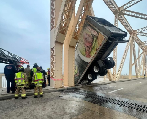 At around 12P.M. on Friday, March 1, 2024, rescue crews responded to a high-angle rescue on the Clark Memorial Bridge. They immediately assessed the scene and began rescue operations to save a semi-truck driver who was still in the cab of her truck hanging off the bridge over the Ohio River. Through their swift and proficient maneuvering, they safely rescued the victim in about 40 minutes.