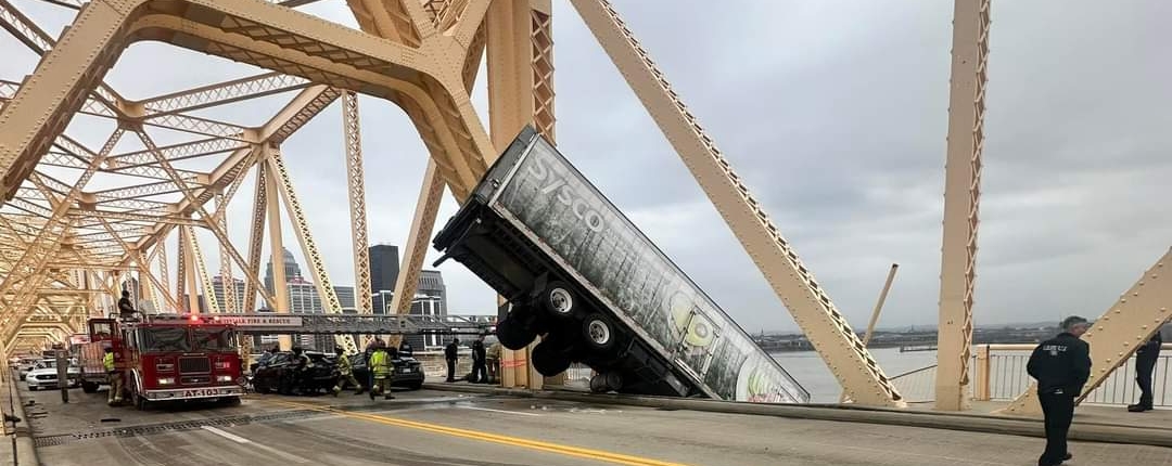 At around 12P.M. on Friday, March 1, 2024, rescue crews responded to a high-angle rescue on the Clark Memorial Bridge. They immediately assessed the scene and began rescue operations to save a semi-truck driver who was still in the cab of her truck hanging off the bridge over the Ohio River. Through their swift and proficient maneuvering, they safely rescued the victim in about 40 minutes.