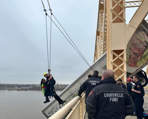 At around 12P.M. on Friday, March 1, 2024, rescue crews responded to a high-angle rescue on the Clark Memorial Bridge. They immediately assessed the scene and began rescue operations to save a semi-truck driver who was still in the cab of her truck hanging off the bridge over the Ohio River. Through their swift and proficient maneuvering, they safely rescued the victim in about 40 minutes.